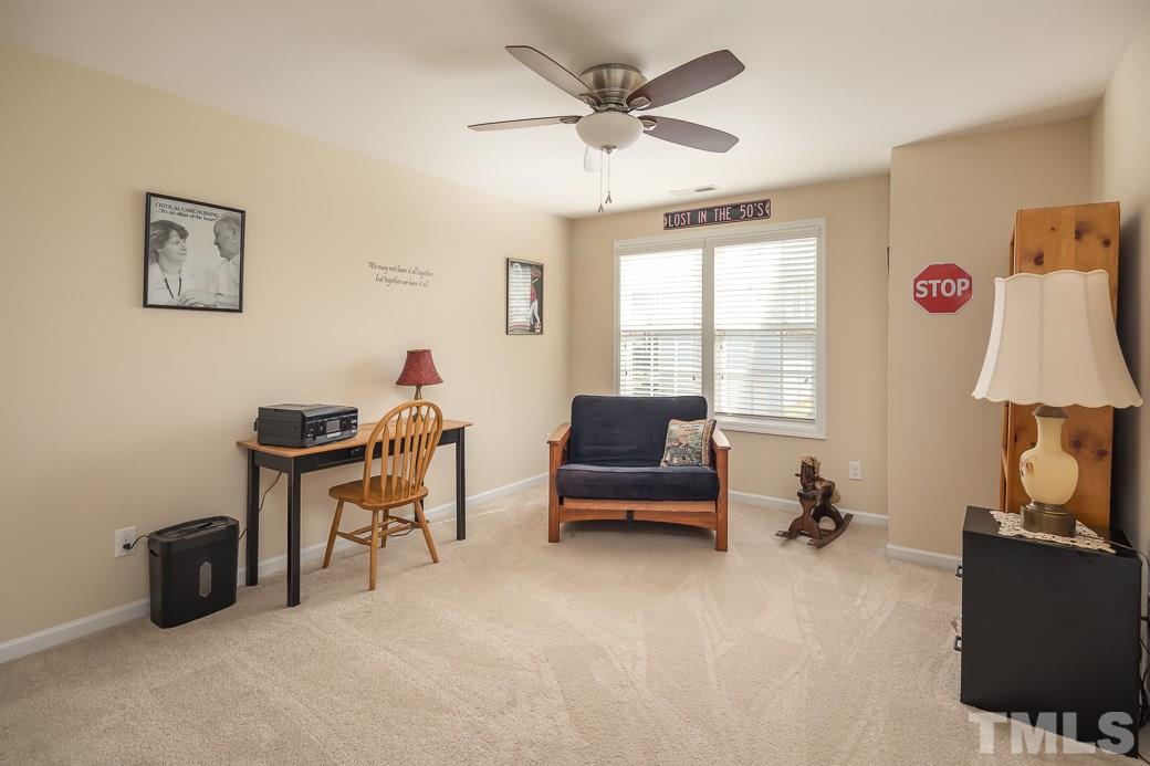 1345 Still Monument Way Raleigh, NC 27603 - Photo 17 of 28 a living room with furniture and a window