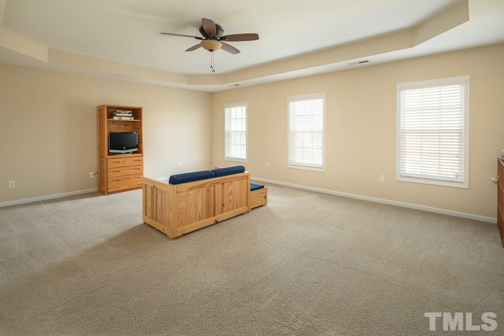 1345 Still Monument Way Raleigh, NC 27603 - Photo 20 of 28 a living room with furniture and a window