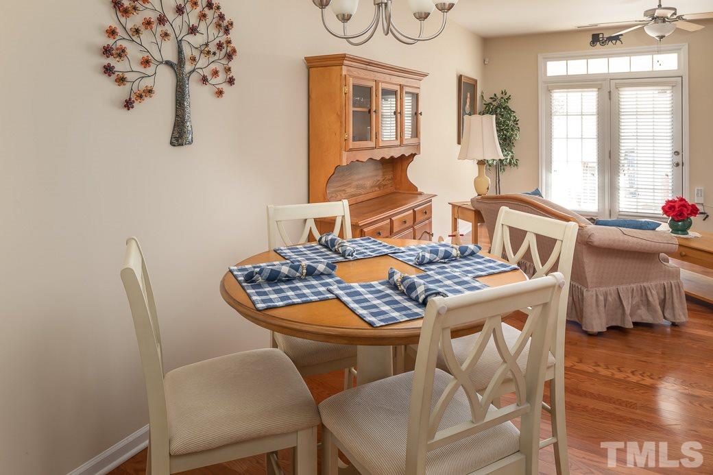 1345 Still Monument Way Raleigh, NC 27603 - Photo 3 of 28 a living room with chairs and a table