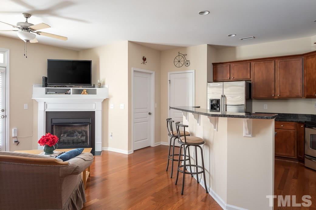 1345 Still Monument Way Raleigh, NC 27603 - Photo 9 of 28 a living room with furniture fireplace and flat screen tv