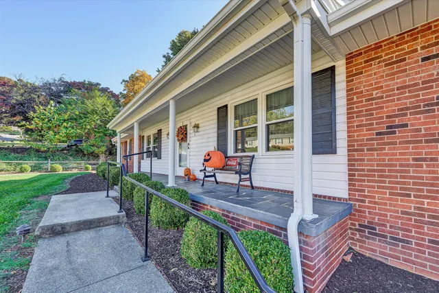 a house view with a sitting space and garden
