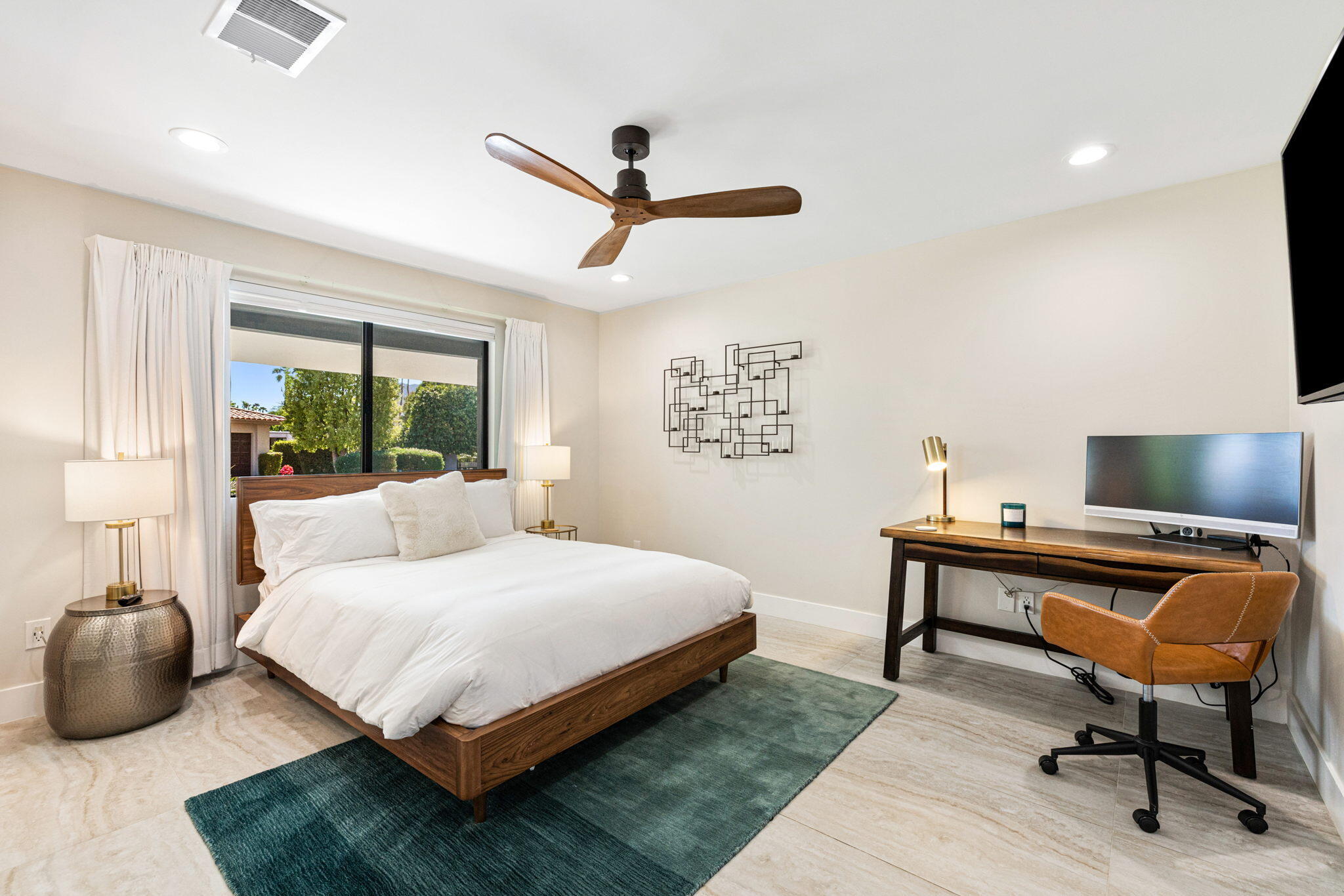 45655 Apache Road, Unit E Indian Wells, CA 92210 - Photo 22 of 31 a bedroom with a bed and a desk