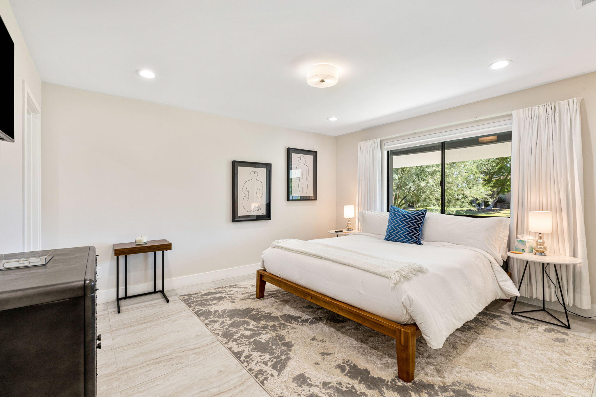 45655 Apache Road, Unit E Indian Wells, CA 92210 - Photo 25 of 31 a bedroom with a large bed and a window