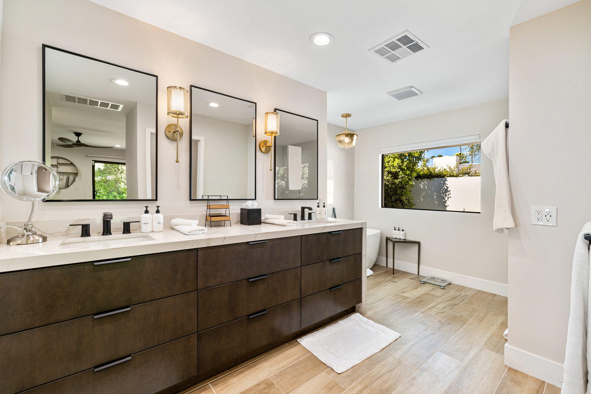 45655 Apache Road, Unit E Indian Wells, CA 92210 - Photo 26 of 31 a spacious bathroom with a double vanity sink mirror and double