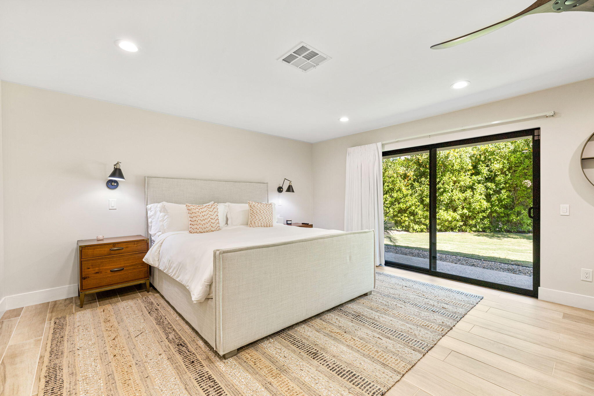 45655 Apache Road, Unit E Indian Wells, CA 92210 - Photo 29 of 31 a bed room with a bed and a large window