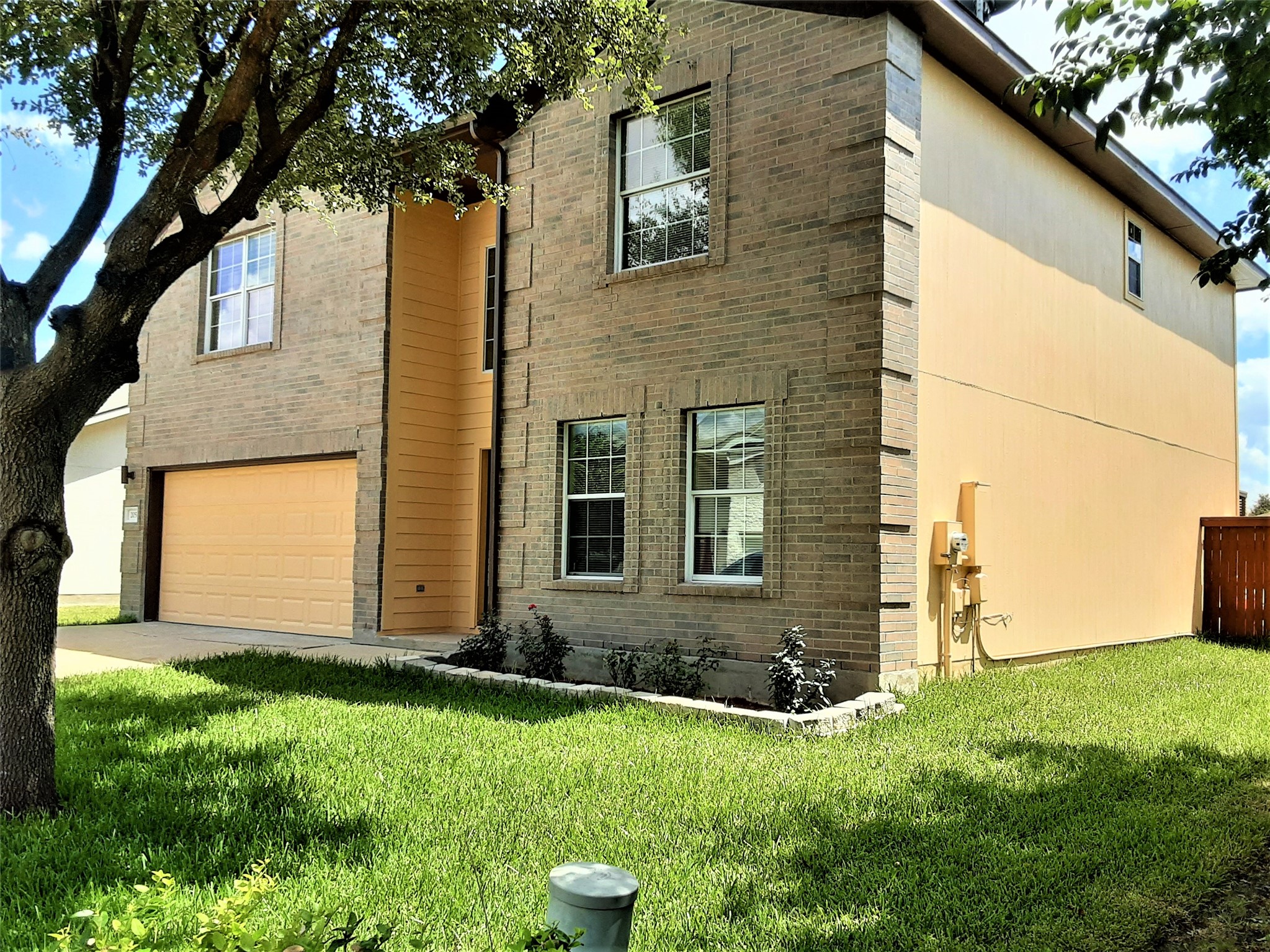 205 Rinehardt Street Hutto, TX 78634 - Photo 11 of 40 a view of a house with backyard