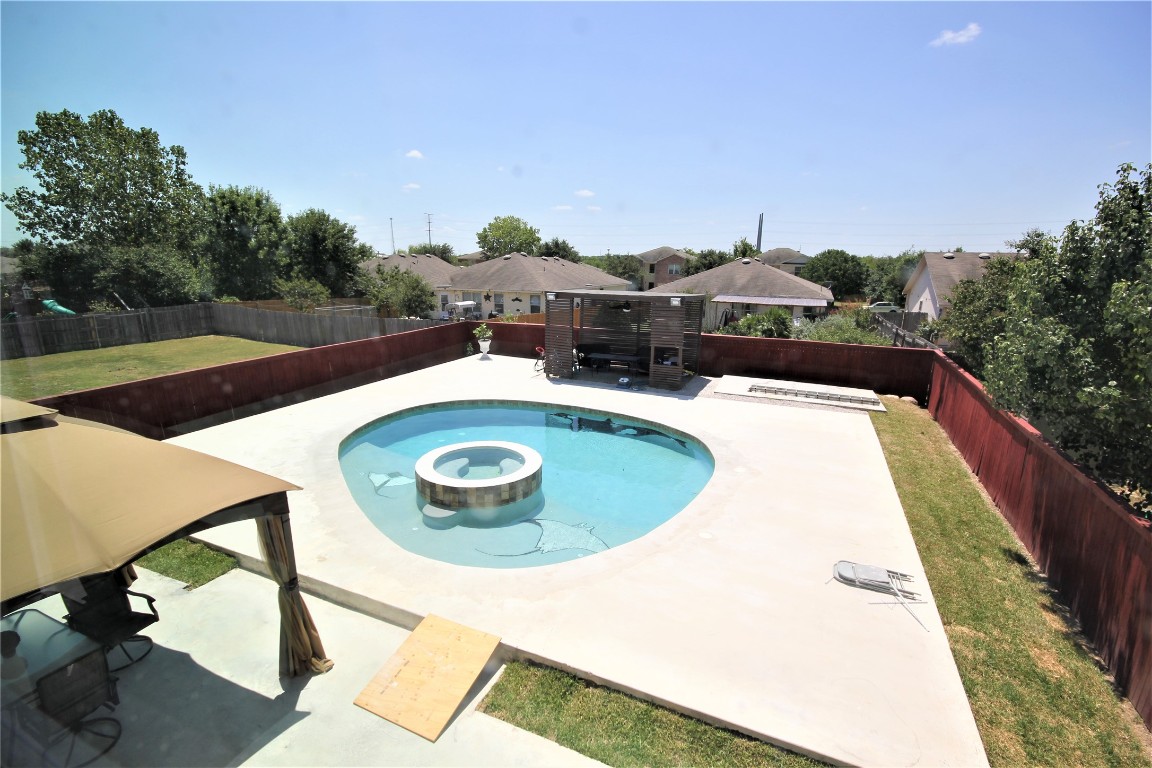 205 Rinehardt Street Hutto, TX 78634 - Photo 2 of 40 a view of a swimming pool with a patio