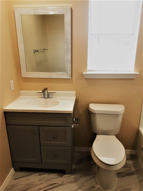 205 Rinehardt Street Hutto, TX 78634 - Photo 24 of 40 a bathroom with a sink and a toilet