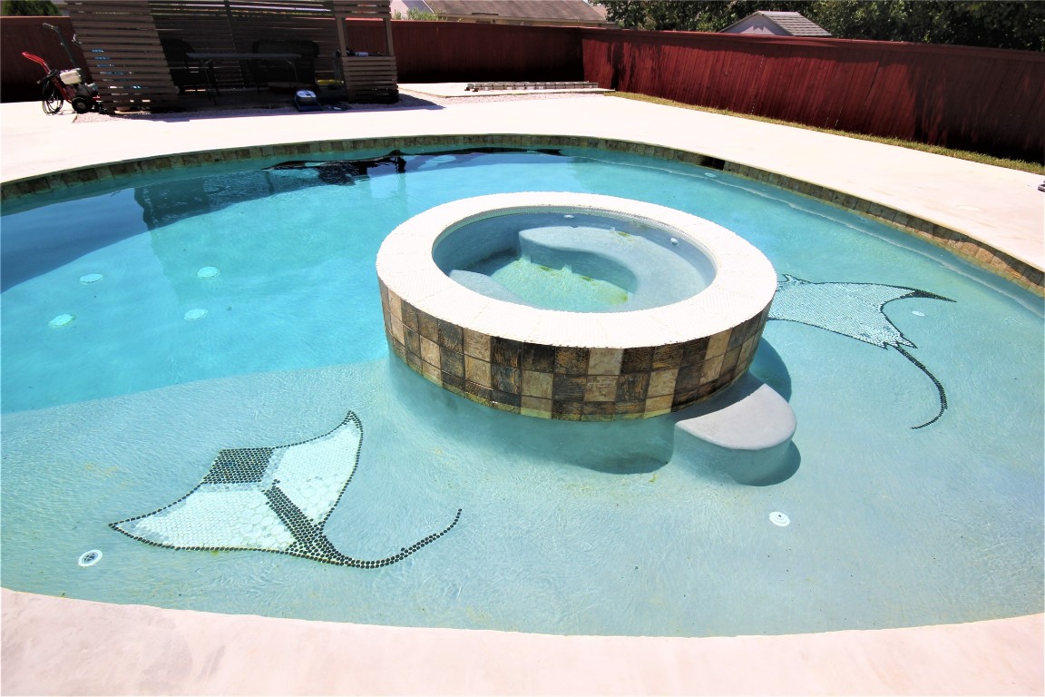 205 Rinehardt Street Hutto, TX 78634 - Photo 3 of 40 a view of fireplace and window