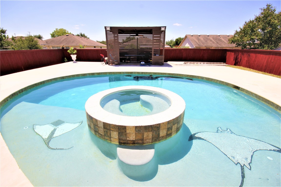 205 Rinehardt Street Hutto, TX 78634 - Photo 33 of 40 a living room with furniture and a fireplace