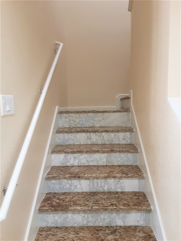 205 Rinehardt Street Hutto, TX 78634 - Photo 37 of 40 a view of staircase with white walls