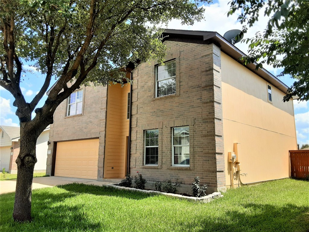205 Rinehardt Street Hutto, TX 78634 - Photo 5 of 40 a view of house with backyard