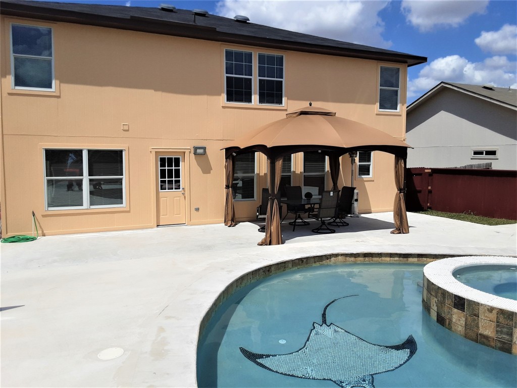 205 Rinehardt Street Hutto, TX 78634 - Photo 6 of 40 a backyard of a house with yard barbeque oven and barbeque oven