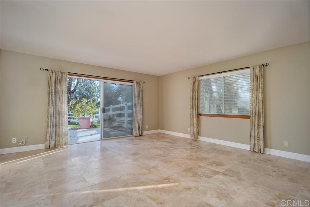1054 Capra Way Fallbrook, CA 92028 - Photo 11 of 25 This spacious master bedroom has access to the back patio to enjoy the views of the meadow behind!