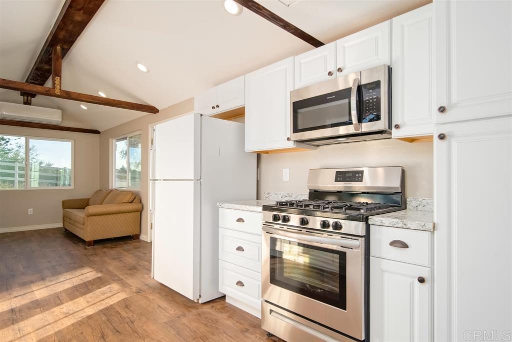 1054 Capra Way Fallbrook, CA 92028 - Photo 16 of 25 Tiny has a kitchen with gas stove and microwave!
