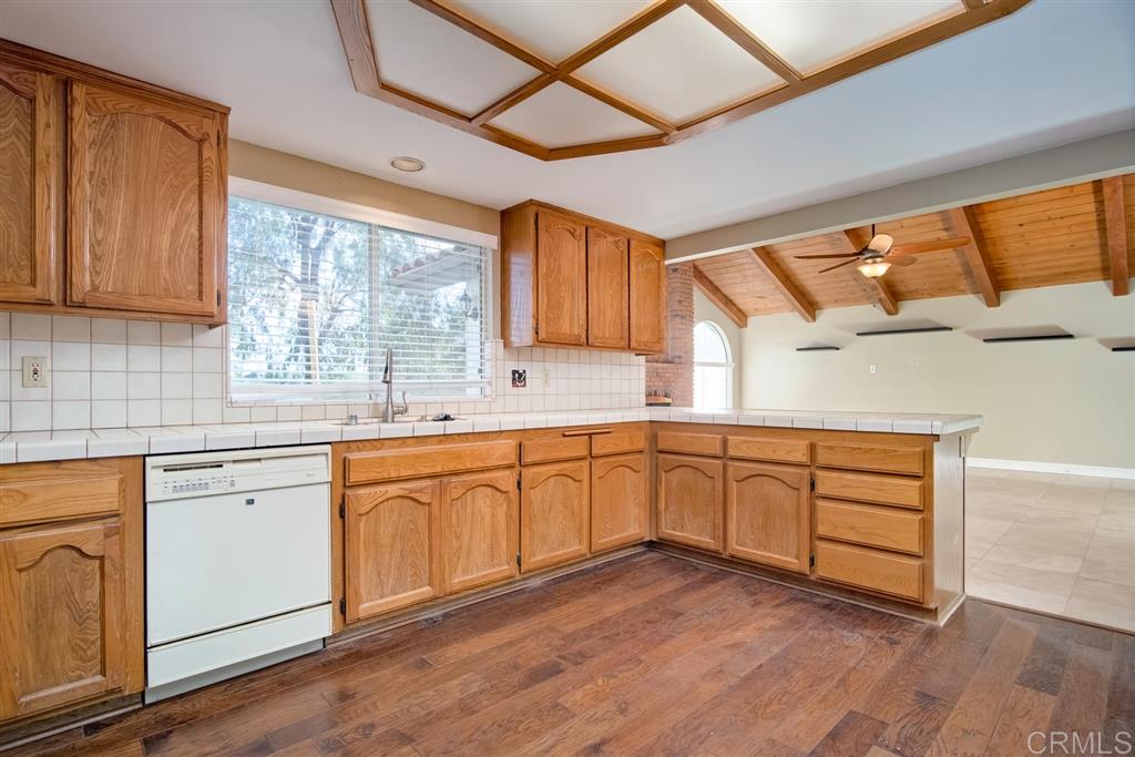 1054 Capra Way Fallbrook, CA 92028 - Photo 8 of 25 Tons of cabinet space in the open kitchen! Even room for you to add an island if you wanted to!