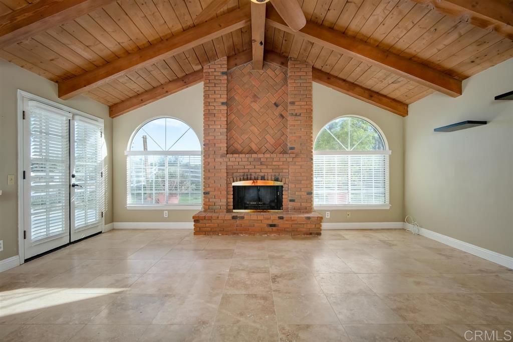 1054 Capra Way Fallbrook, CA 92028 - Photo 9 of 25 LOVE these wood beam ceilings and brick fireplace. This room is so cozy and inviting!