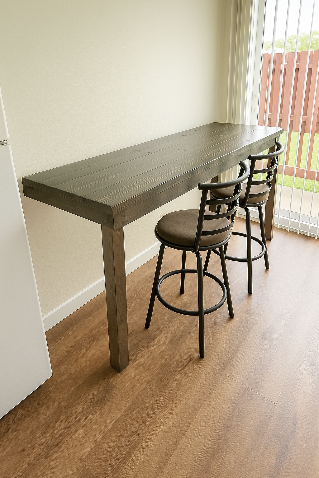 4461 Kamoa Road, Unit D12 Kapaa, HI 96746 - Photo 5 of 13 a table and chair in a room with wooden floor