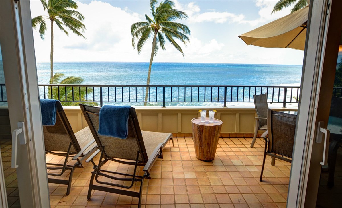 2640 Puuholo Road, Unit 134 Koloa, HI 96756 - Photo 1 of 20 a view of a chairs and table in a balcony