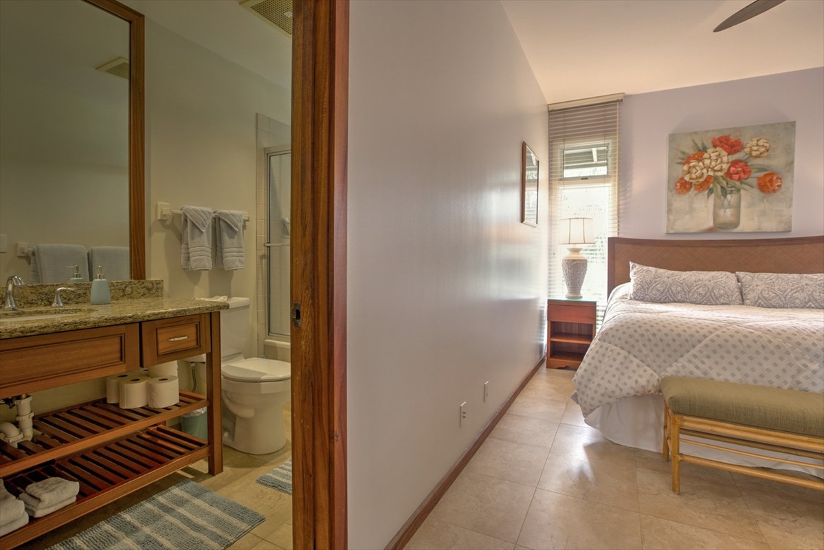 2640 Puuholo Road, Unit 134 Koloa, HI 96756 - Photo 11 of 20 a bedroom with a bed and a couch