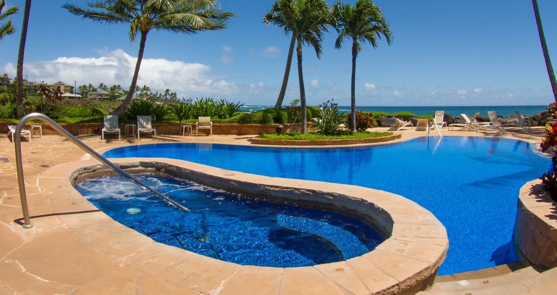 2640 Puuholo Road, Unit 134 Koloa, HI 96756 - Photo 15 of 20 a view of a swimming pool with a table and chairs