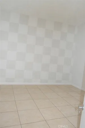 an empty room with a empty space and windows