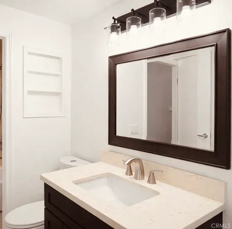 a bathroom with a toilet and a sink