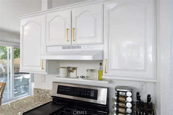 a bathroom with a sink and cabinets