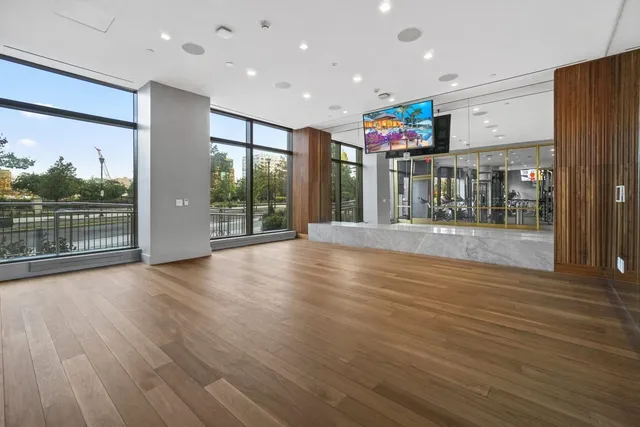 a view of livingroom with furniture wooden floor and windows