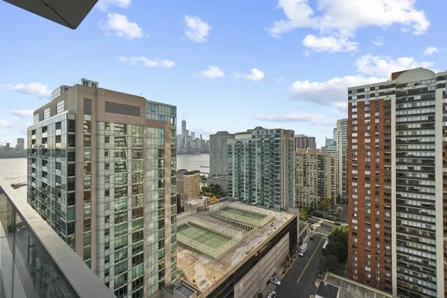 a lobby with furniture and floor to ceiling window