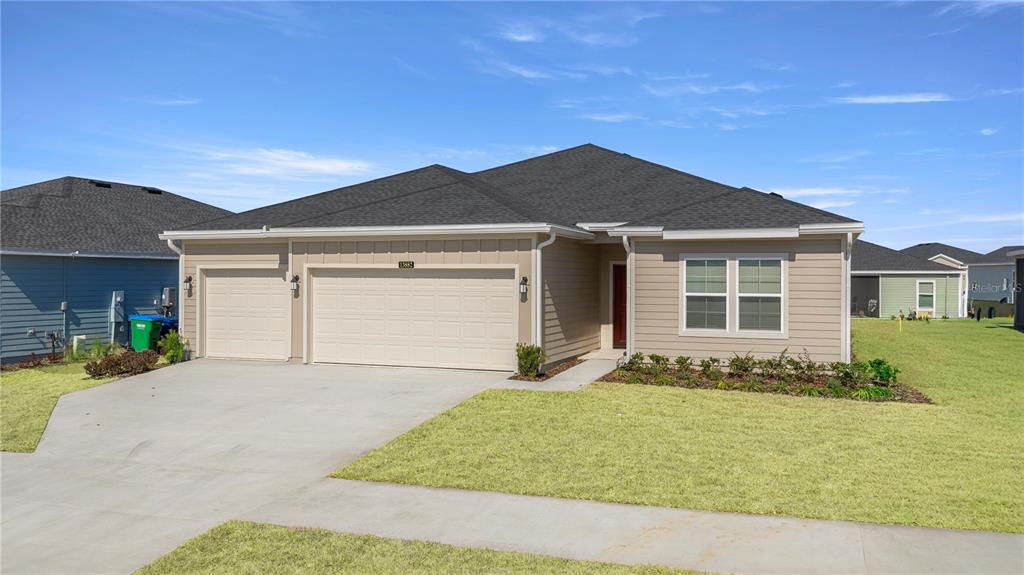 a front view of a house with a yard