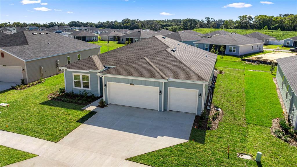6896 Southwest 87th Street Ocala, FL 34476 - Photo 4 of 5 an aerial view of a house with a garden
