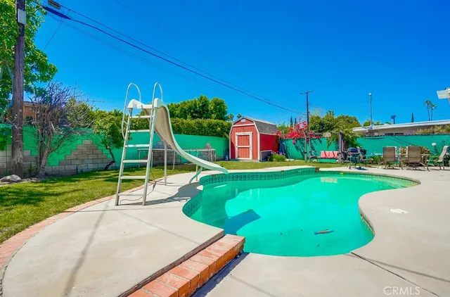 a view of an house with backyard porch and sitting area