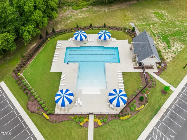 an aerial view of a house with a ocean view
