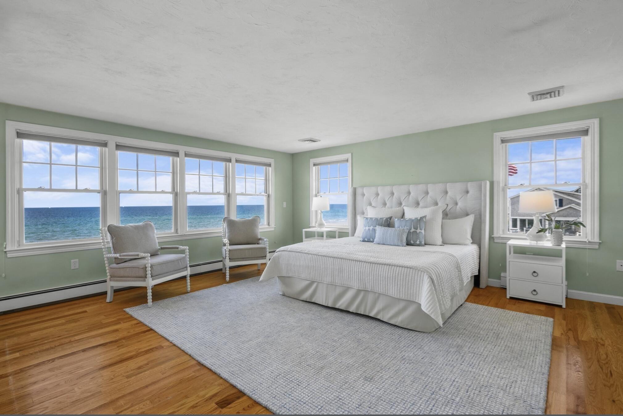 67 Phillips Road Sagamore Beach, MA 02562 - Photo 18 of 34 a bedroom with a bed and a large window