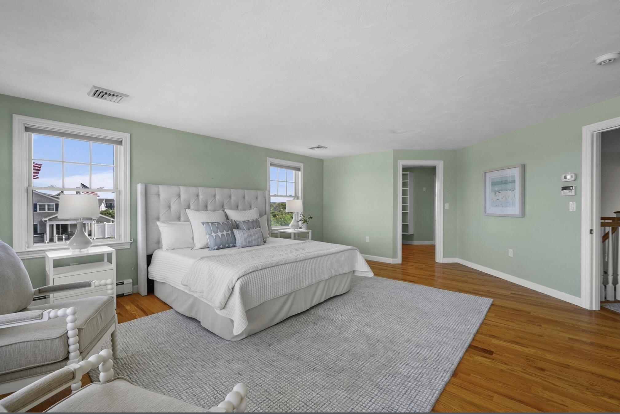 67 Phillips Road Sagamore Beach, MA 02562 - Photo 19 of 34 a spacious bedroom with a bed and glass window