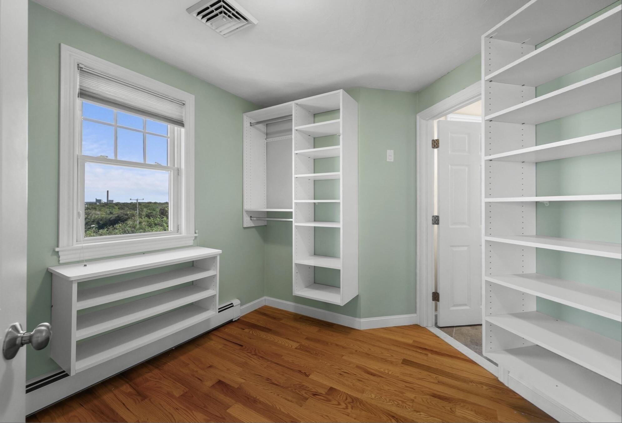 67 Phillips Road Sagamore Beach, MA 02562 - Photo 21 of 34 a view of empty room with wooden floor and fan