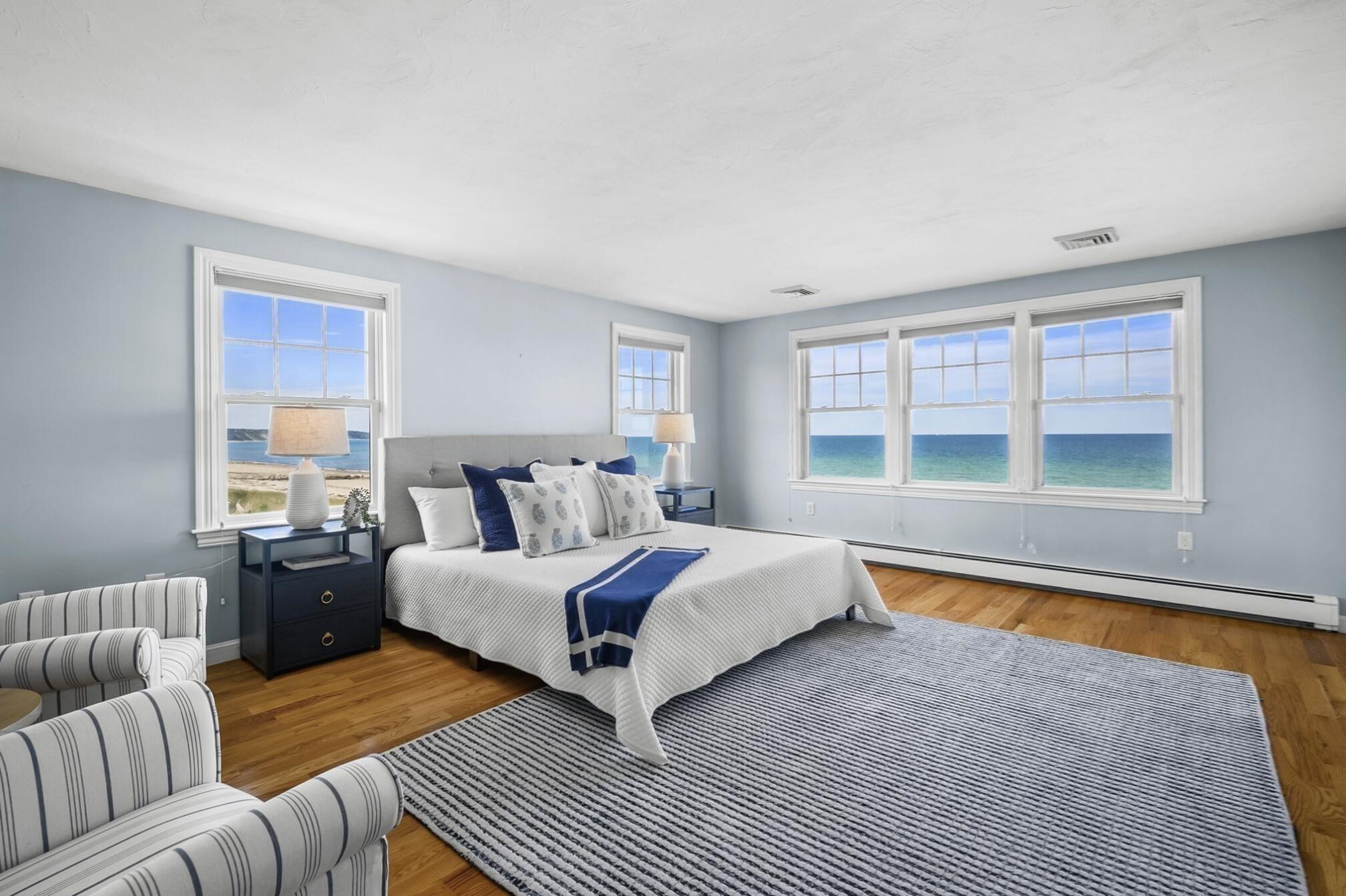 67 Phillips Road Sagamore Beach, MA 02562 - Photo 22 of 34 a bedroom with a bed and a large window