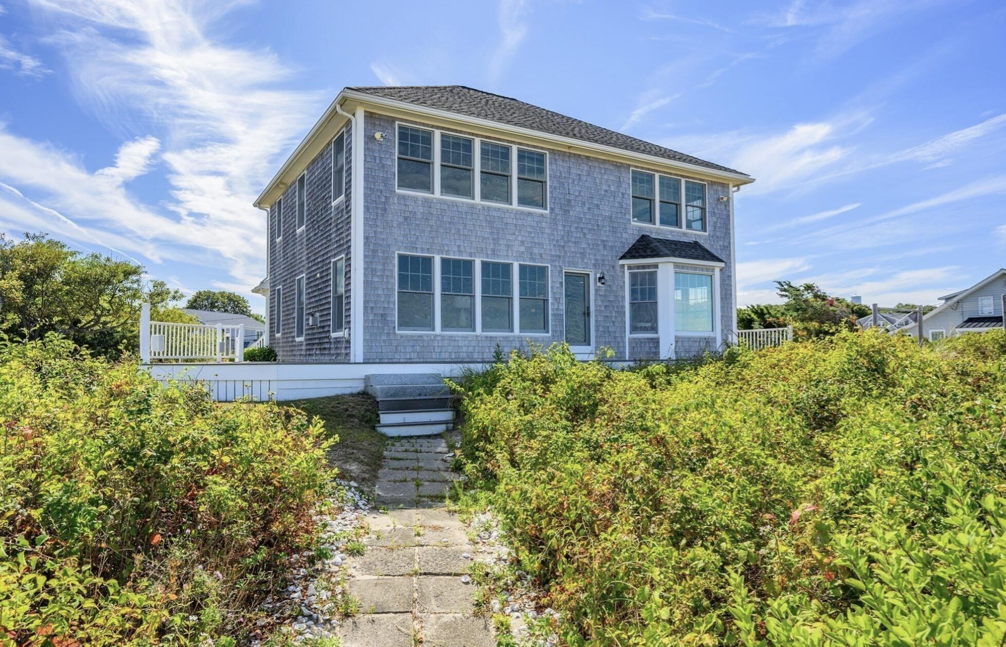 67 Phillips Road Sagamore Beach, MA 02562 - Photo 27 of 34 a front view of a house with garden