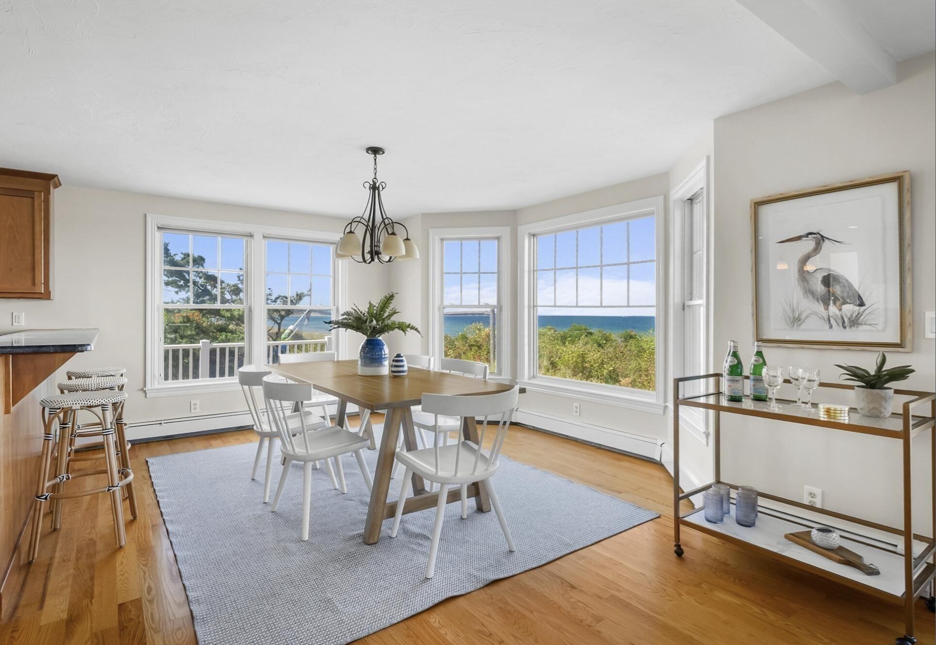 67 Phillips Road Sagamore Beach, MA 02562 - Photo 8 of 34 a view of a dining room with furniture window and wooden floor