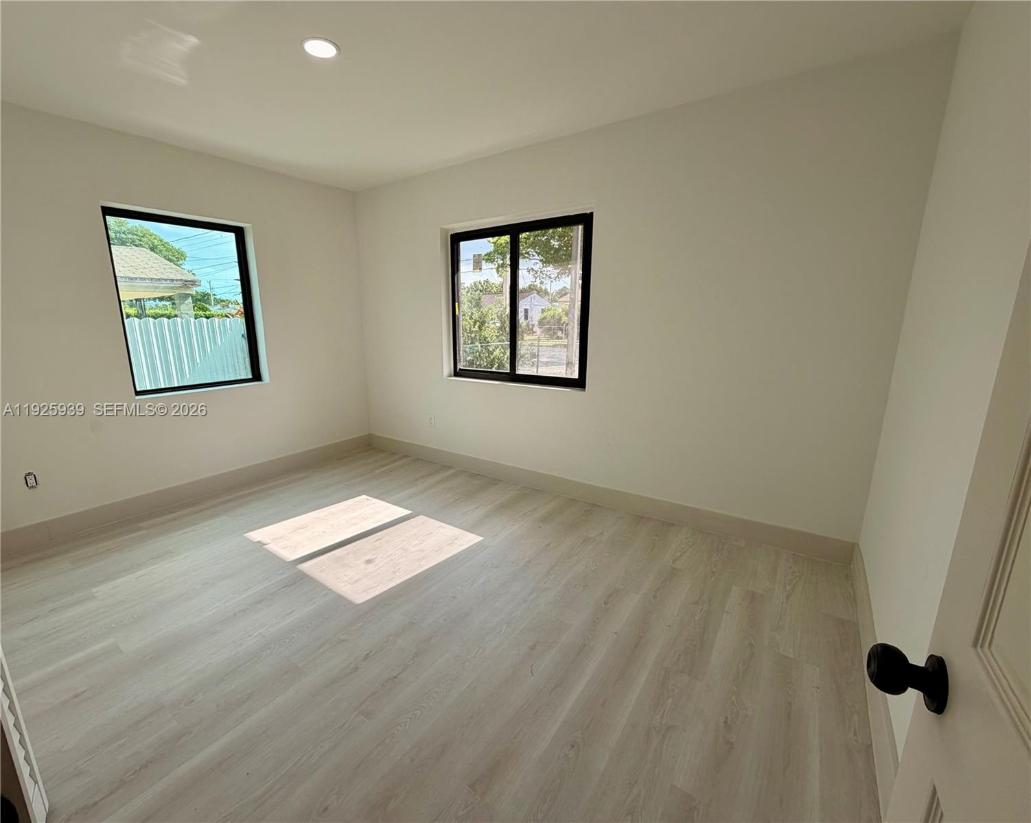 3527 Northwest 17th Street Miami, FL 33125 - Photo 12 of 16 a view of empty room with window