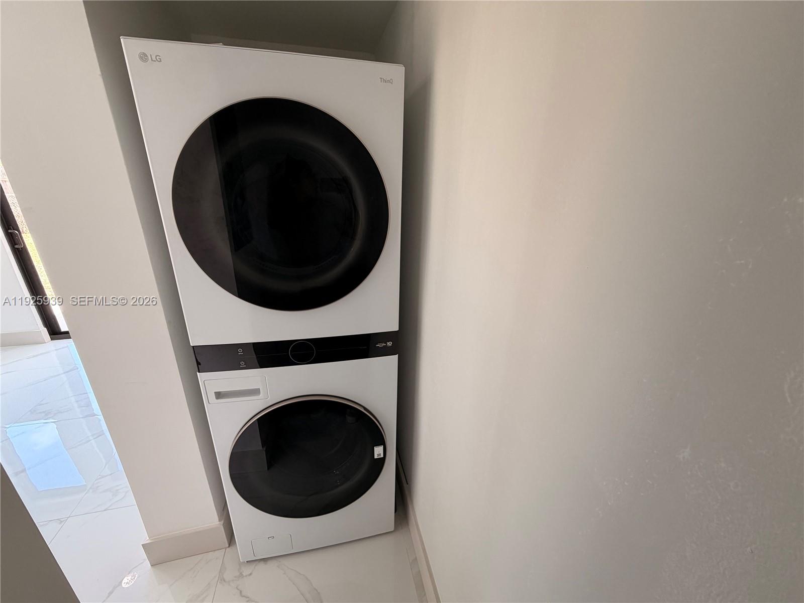 3527 Northwest 17th Street Miami, FL 33125 - Photo 14 of 16 a utility room with dryer and washer