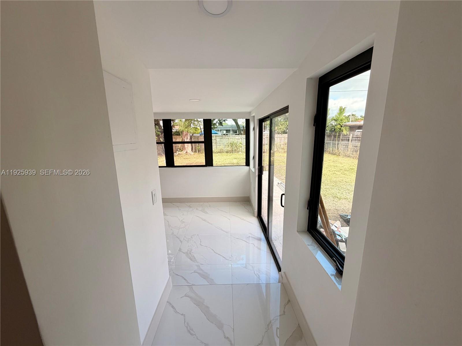 3527 Northwest 17th Street Miami, FL 33125 - Photo 5 of 16 an entryway with a fireplace