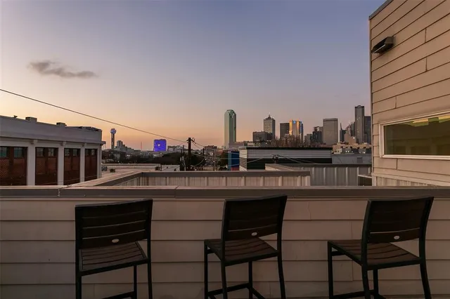 a view of a balcony with chairs