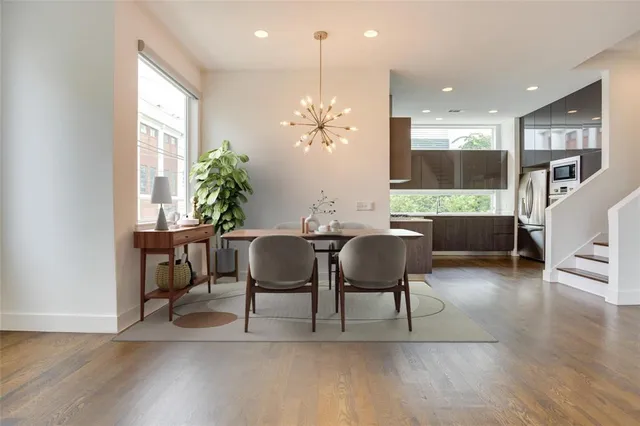a view of a dining room with furniture window and wooden floor