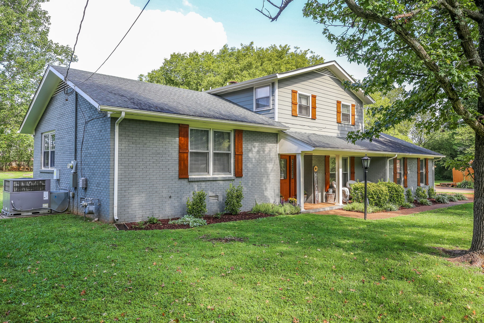 117 Paschal Drive Murfreesboro, TN 37128 - Photo 2 of 32 a front view of a house with a yard and trees
