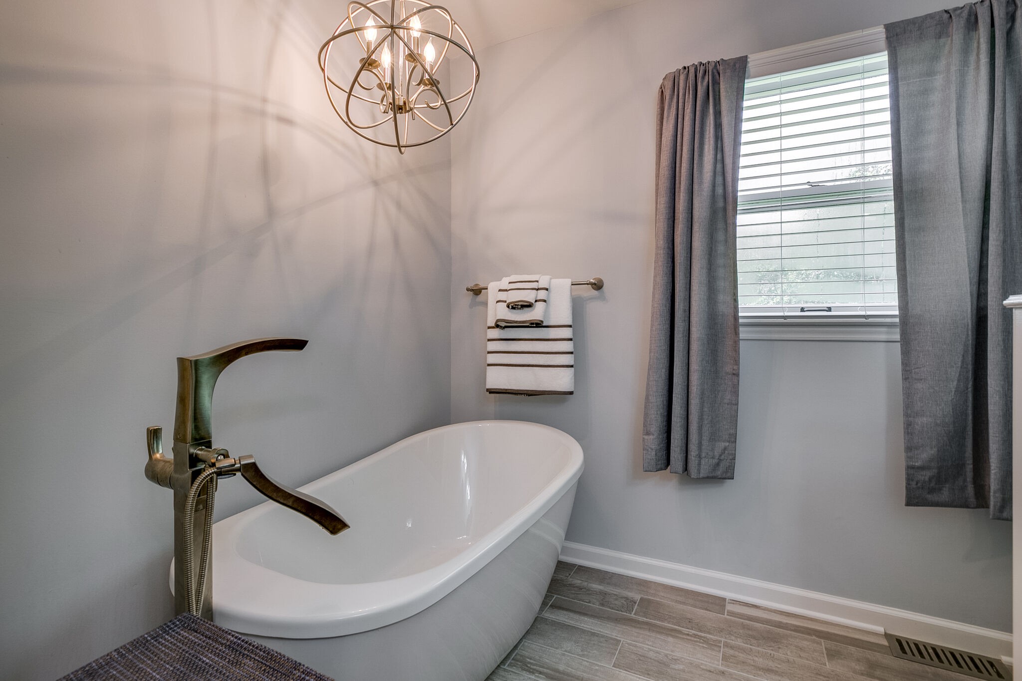 117 Paschal Drive Murfreesboro, TN 37128 - Photo 28 of 32 a bathroom with a sink a bathtub and window