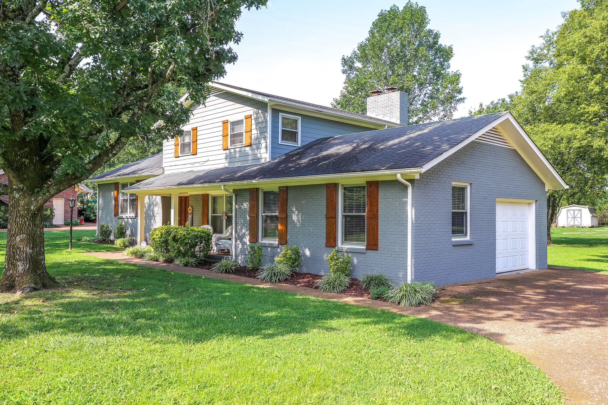 117 Paschal Drive Murfreesboro, TN 37128 - Photo 3 of 32 a front view of a house with a yard and porch