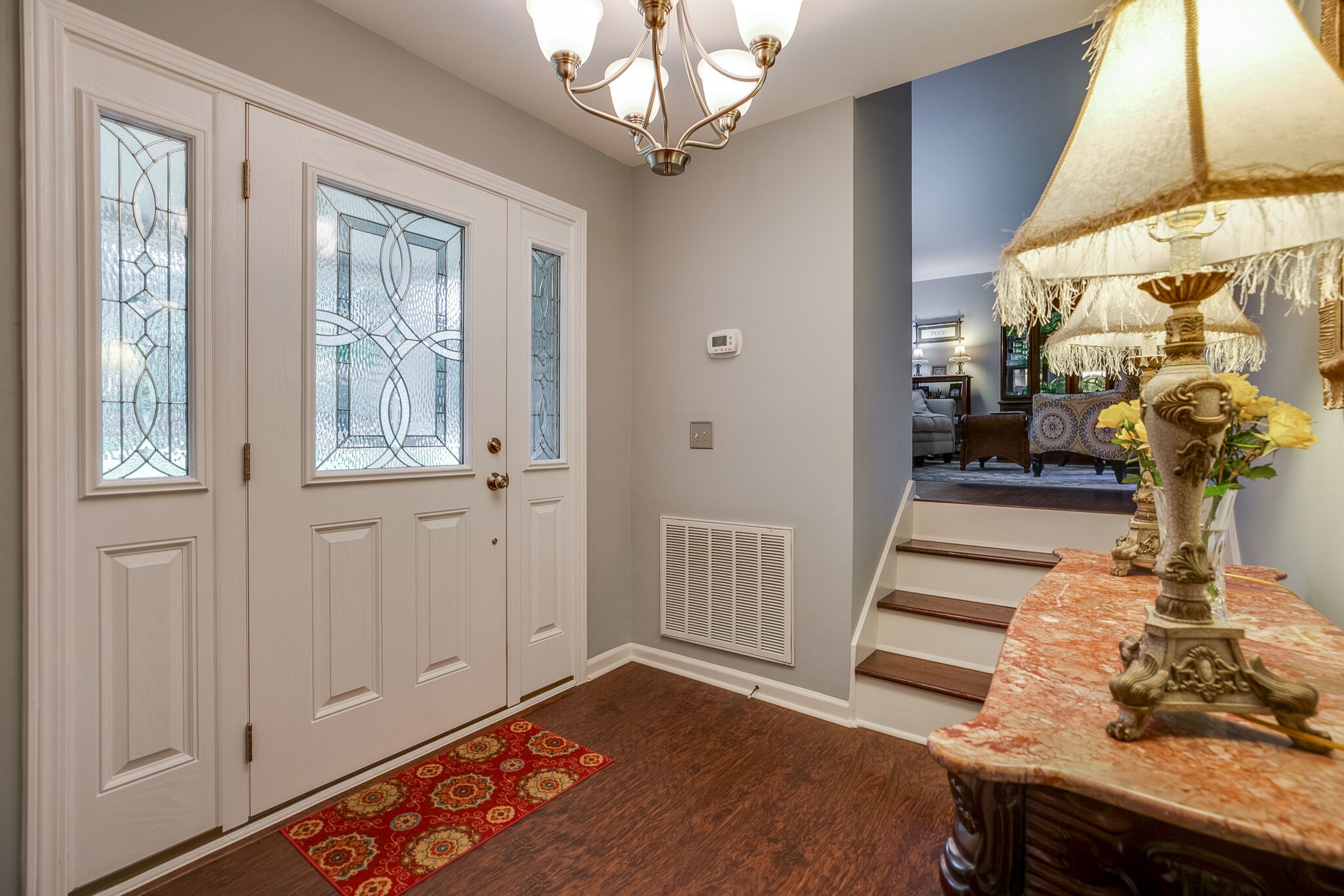 117 Paschal Drive Murfreesboro, TN 37128 - Photo 6 of 32 a bedroom with a bed and a chandelier