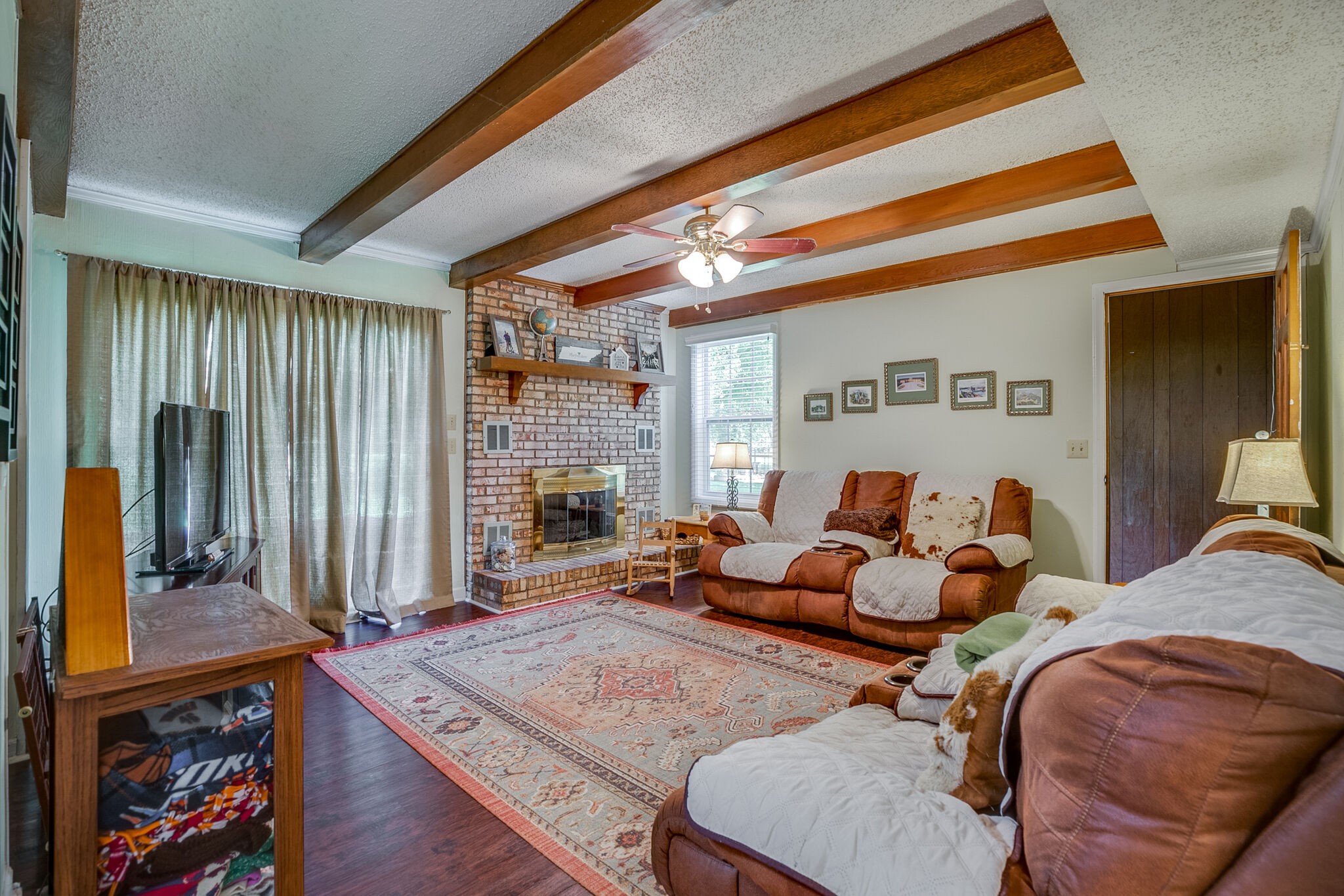 117 Paschal Drive Murfreesboro, TN 37128 - Photo 8 of 32 a living room with furniture a window and a flat screen tv